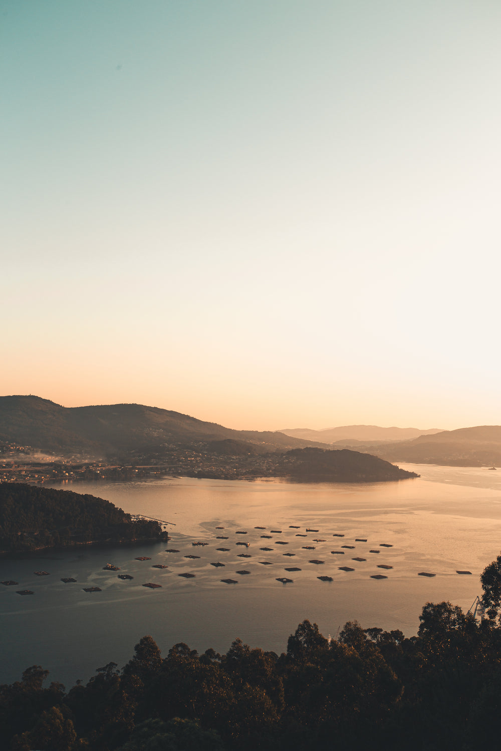 mountains and a river filled with docks