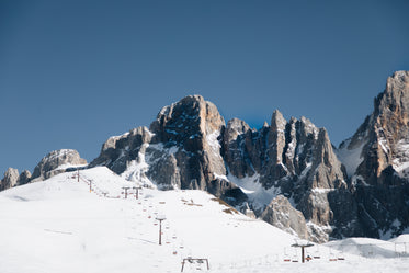 mountains surrounding a ski lift