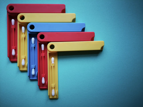 multi-colored plastic holders for cotton buds