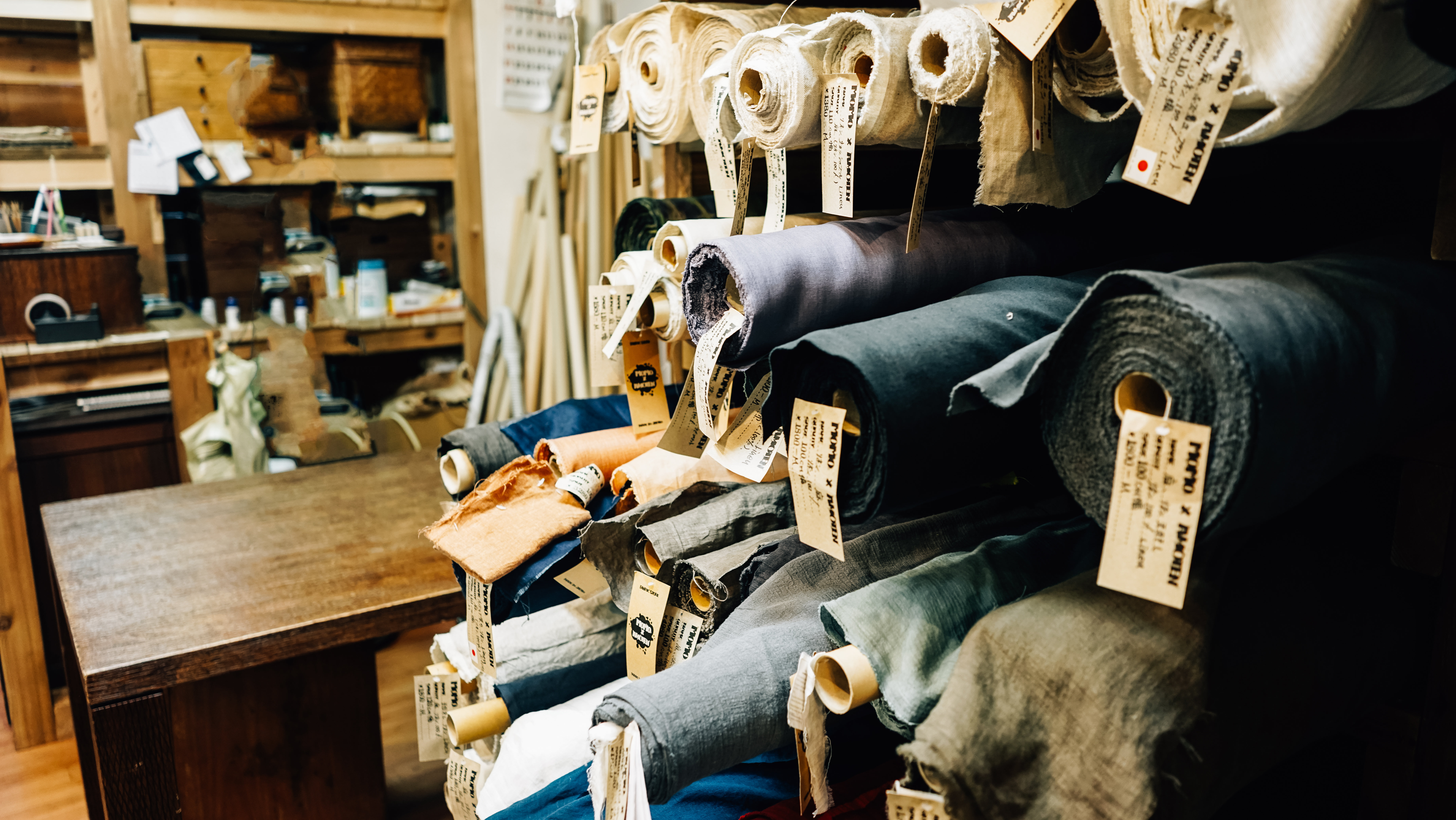 Multiple Rolls Of Fabric On Shelves