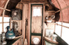 musical and rustic domestic objects inside a caravan