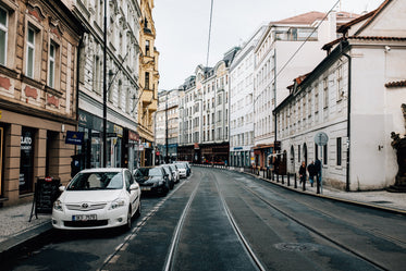 narrow city street with tall thin buildings