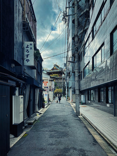 narrow street lined with tall buildings