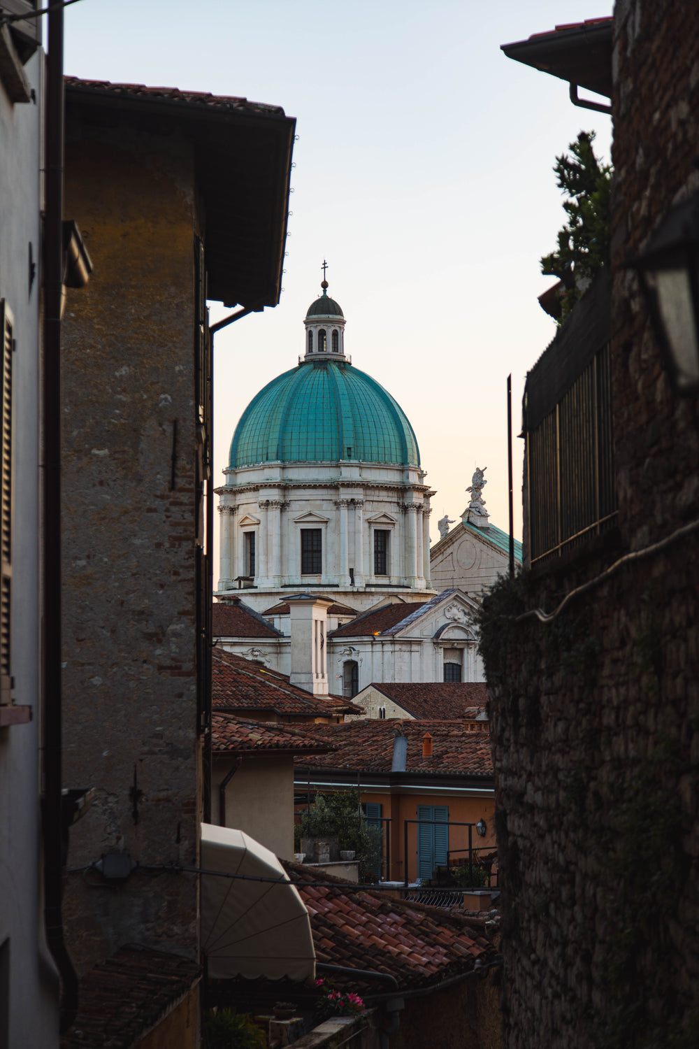 narrow view of roof tops and church