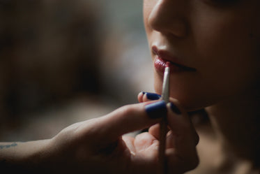 natural lip gloss being applied