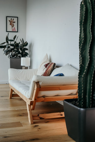 natural white sofa on wood frame
