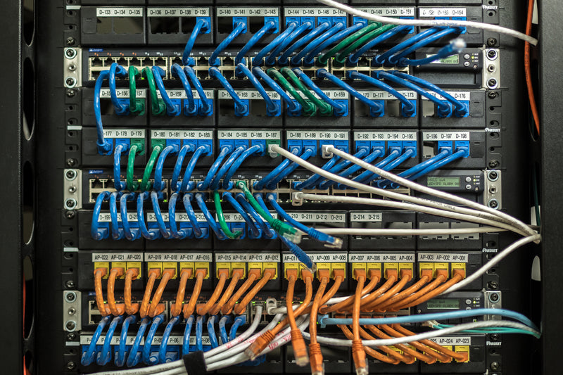a bunch of cables and cables in a server - network server switches