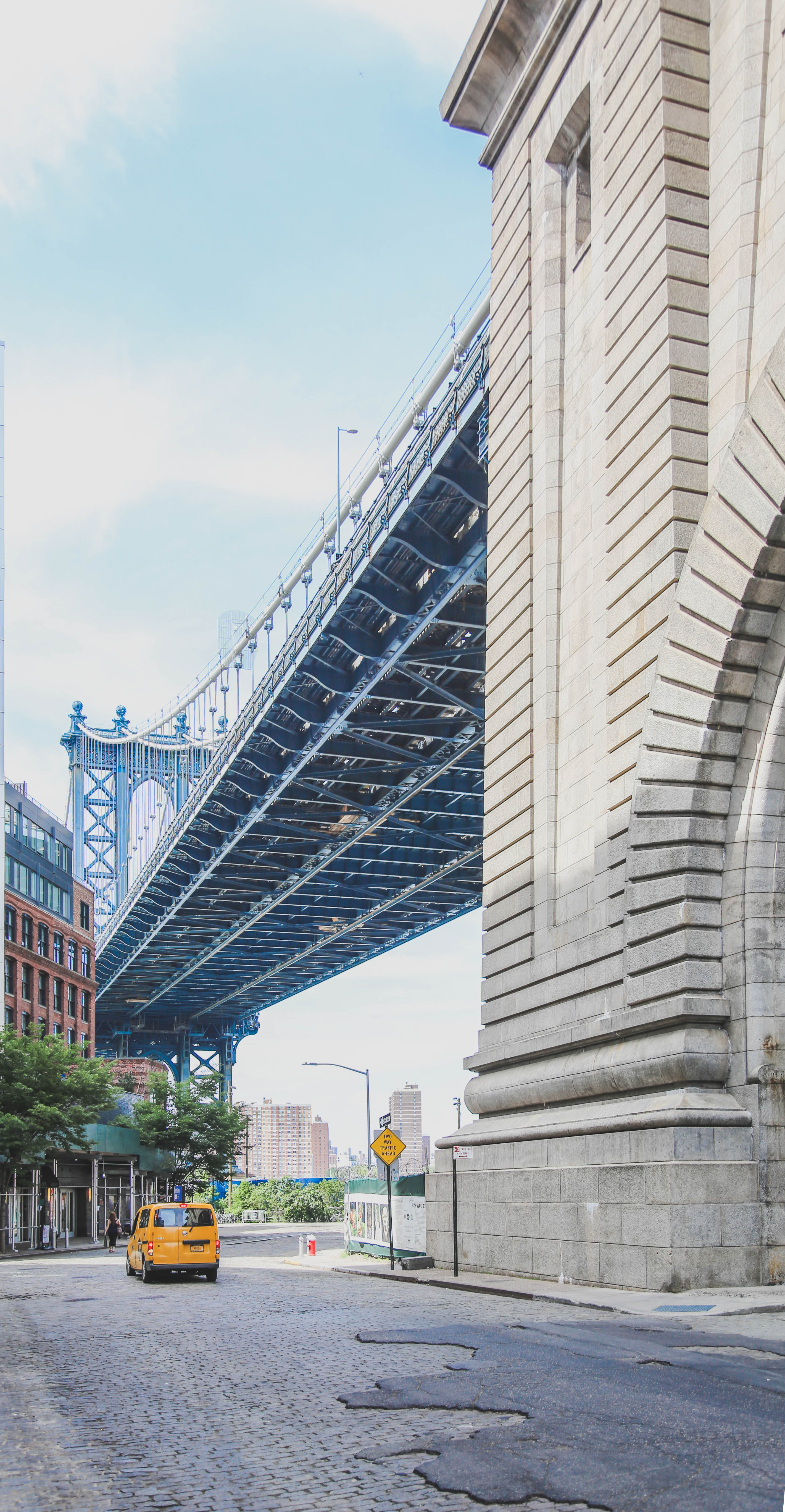 Browse Free HD Images of New York Taxi Under Brooklyn Bridge