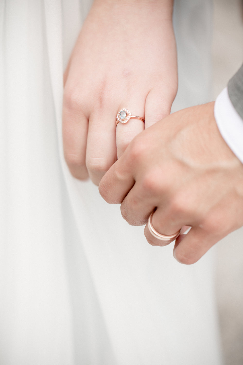 newly weds hold hands close up