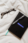 notebook and glasses