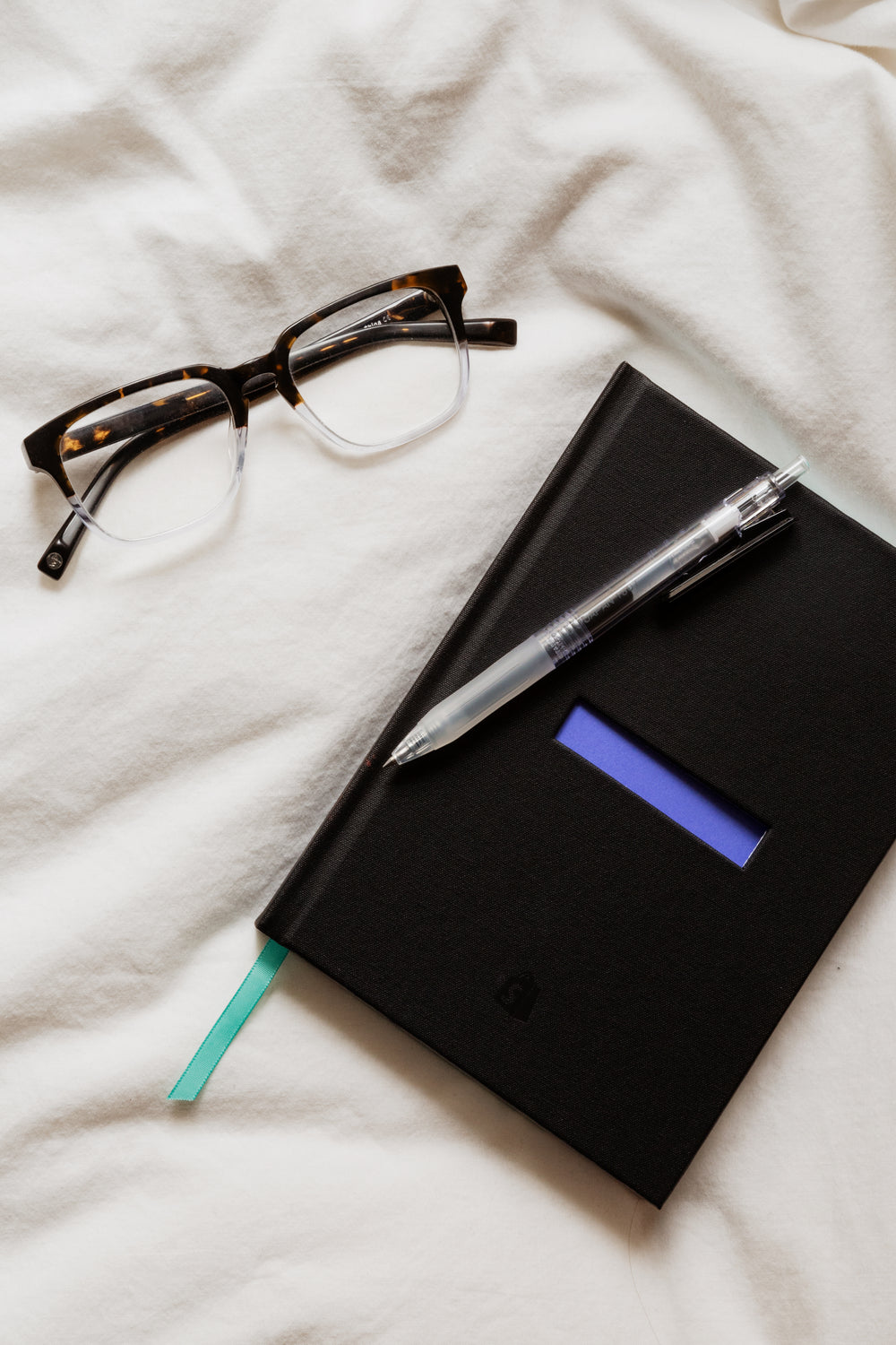 notebook and glasses