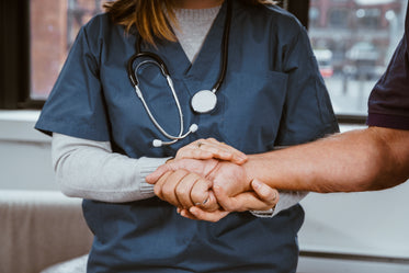 nurse helping patient