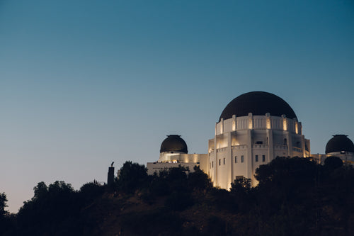 observatory lit under night sky
