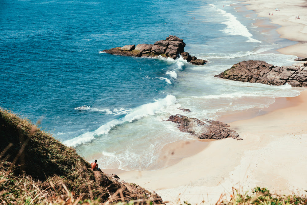 ocean waves on rocks and sand