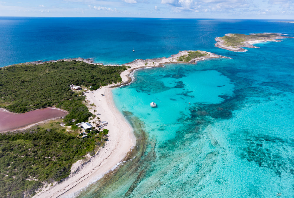 oceanside properties with anchored sailboat