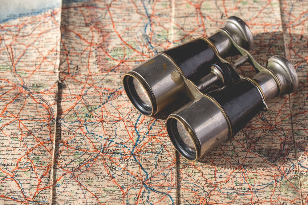 old map and binoculars