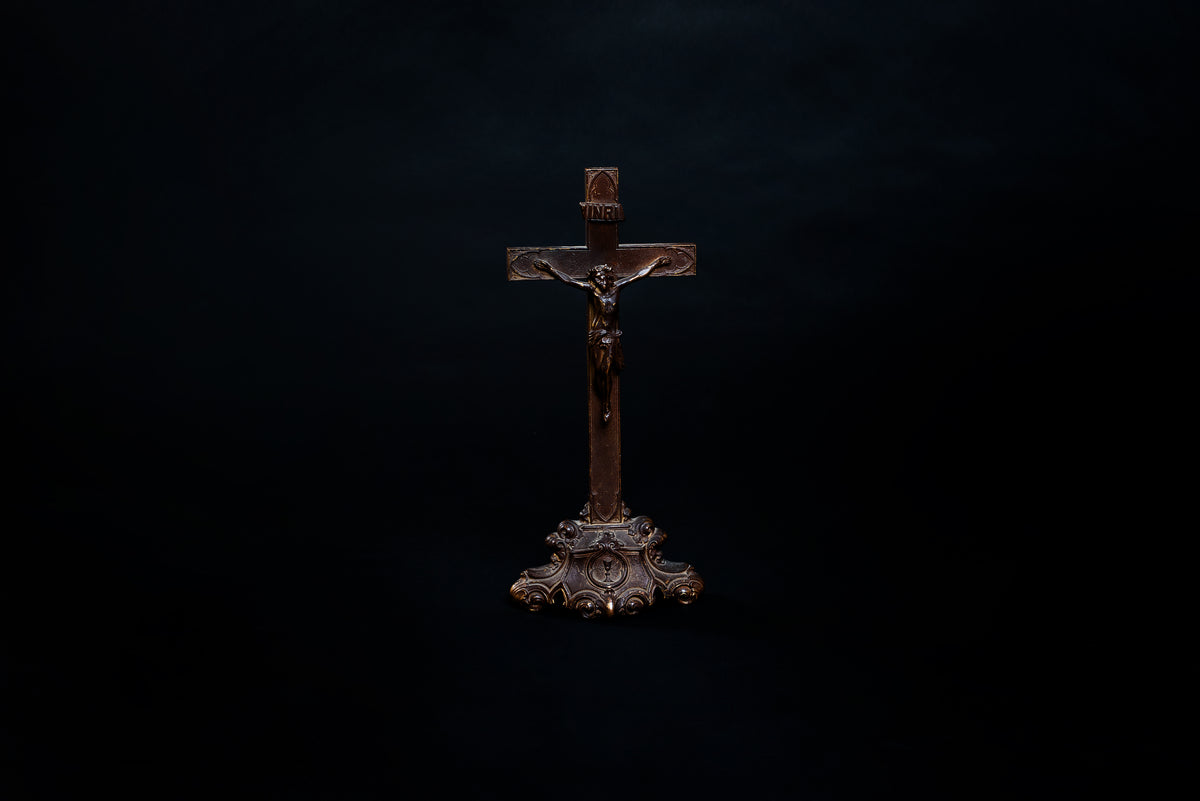 old wooden cross on black background