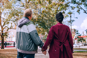 older couple holding hands