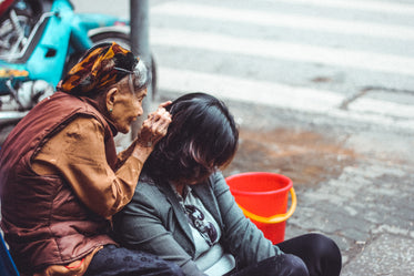 older woman grooming younger