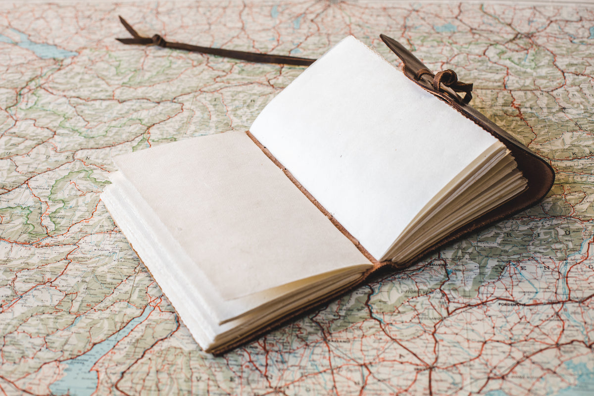 open notebook on world map