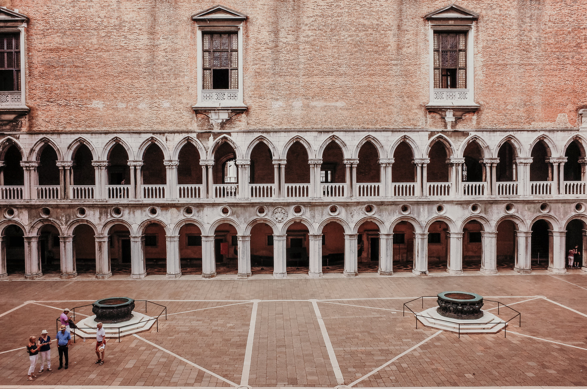 open-stone-courtyard-with-white-archways