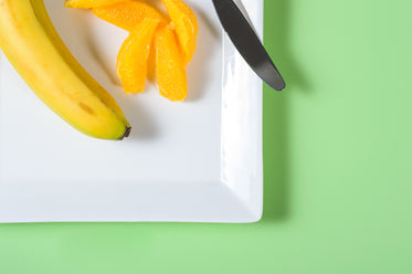 orange and banana on plate