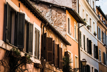 orange building with brown window shutters