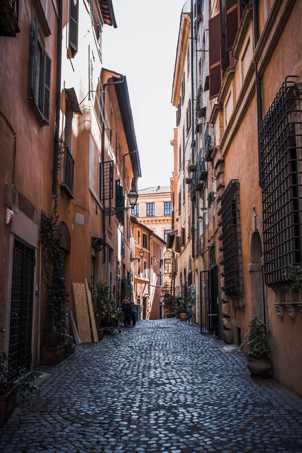 orange buildings line a cobblestone street