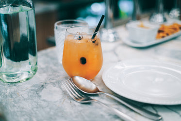 orange cocktail on table