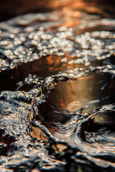 orange colors of cascading ripples in water