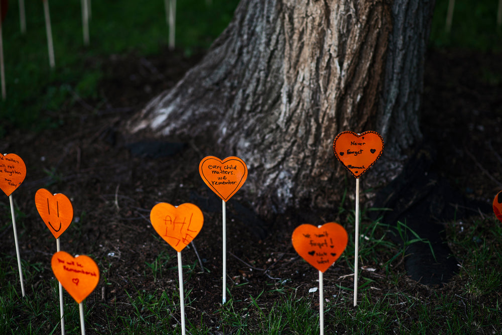 orange hearts with hand written text of remembrance