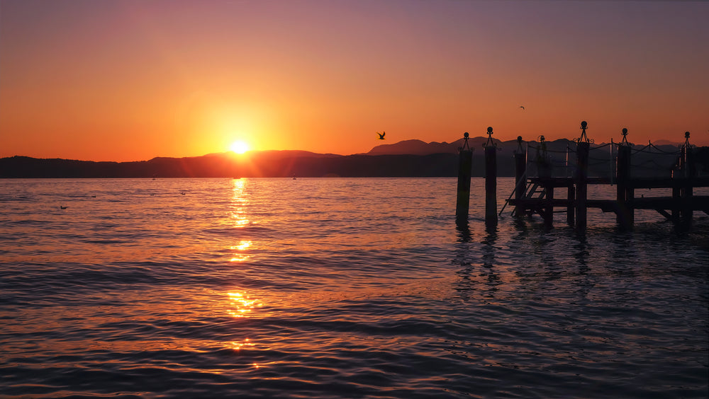 orange sunset over lake