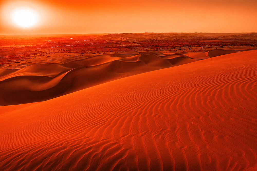 Orange Sunset Over Wavy Sand Dune Landscape