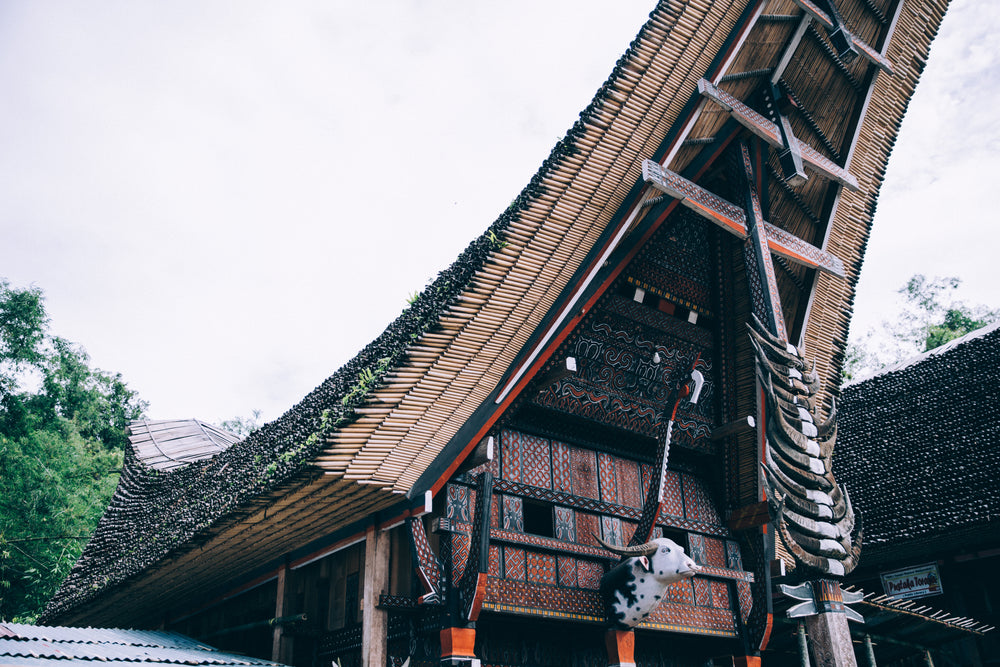 ornate indonesian bamboo temple towers overhead