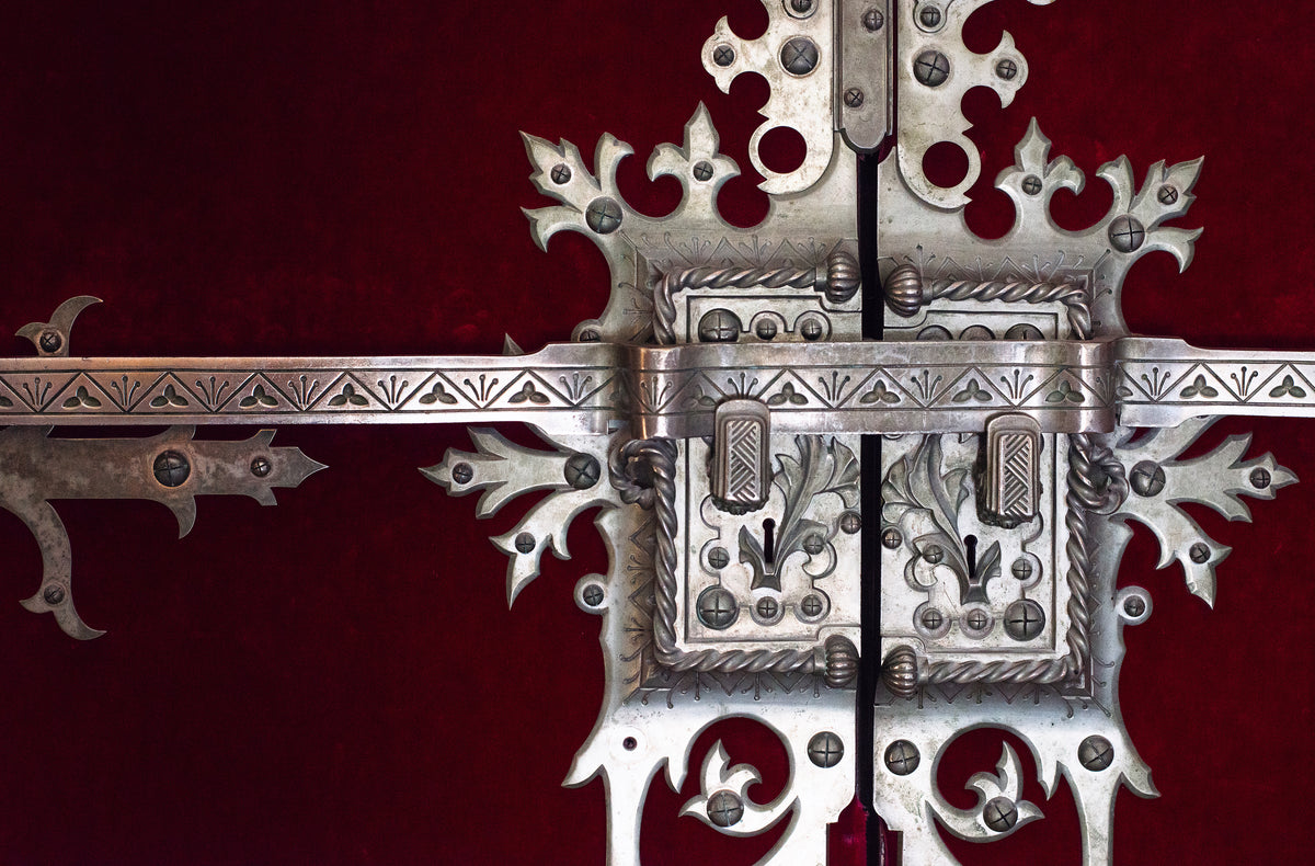 ornate lock on antique cabinet