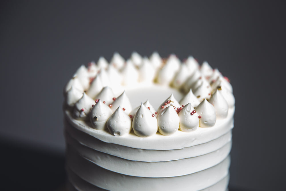 ornate white birthday cake