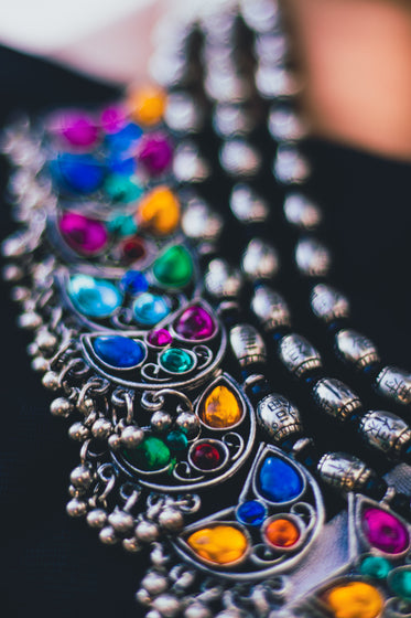 ornately designed jewelry with colored stones