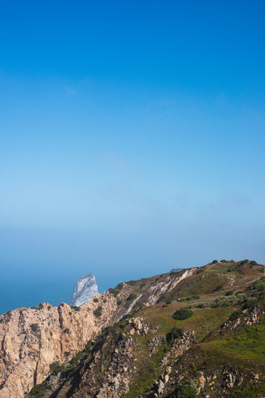 overlooking the sea from atop a mountain