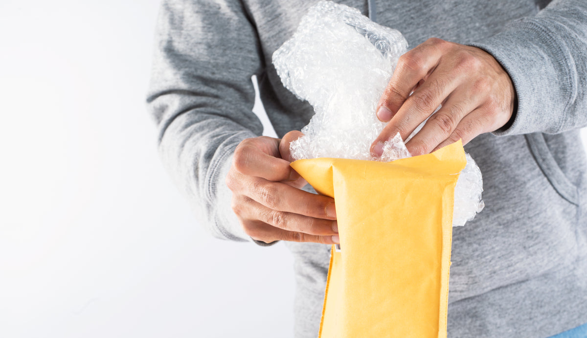packing bubble wrap into an envelope