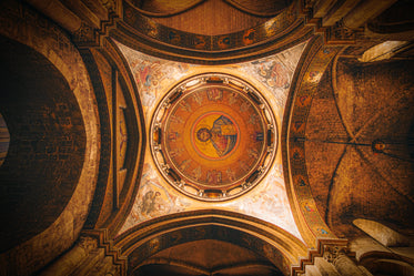 painted ceiling in a church with stone archways