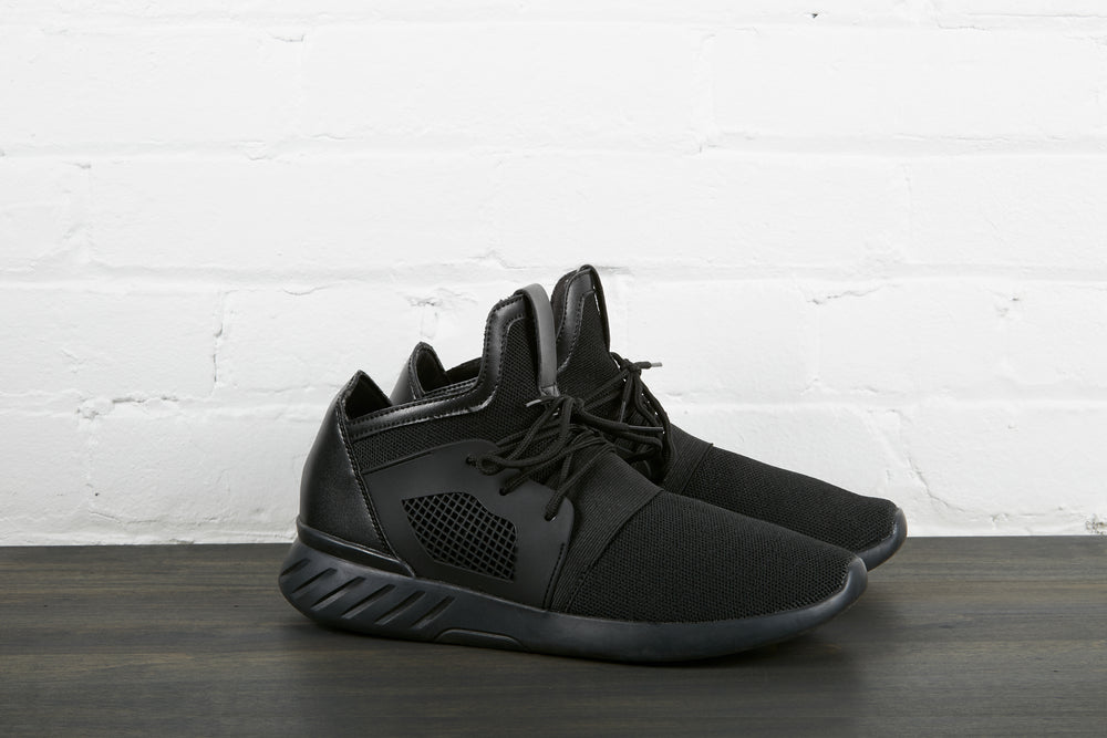 pair of all black sneakers