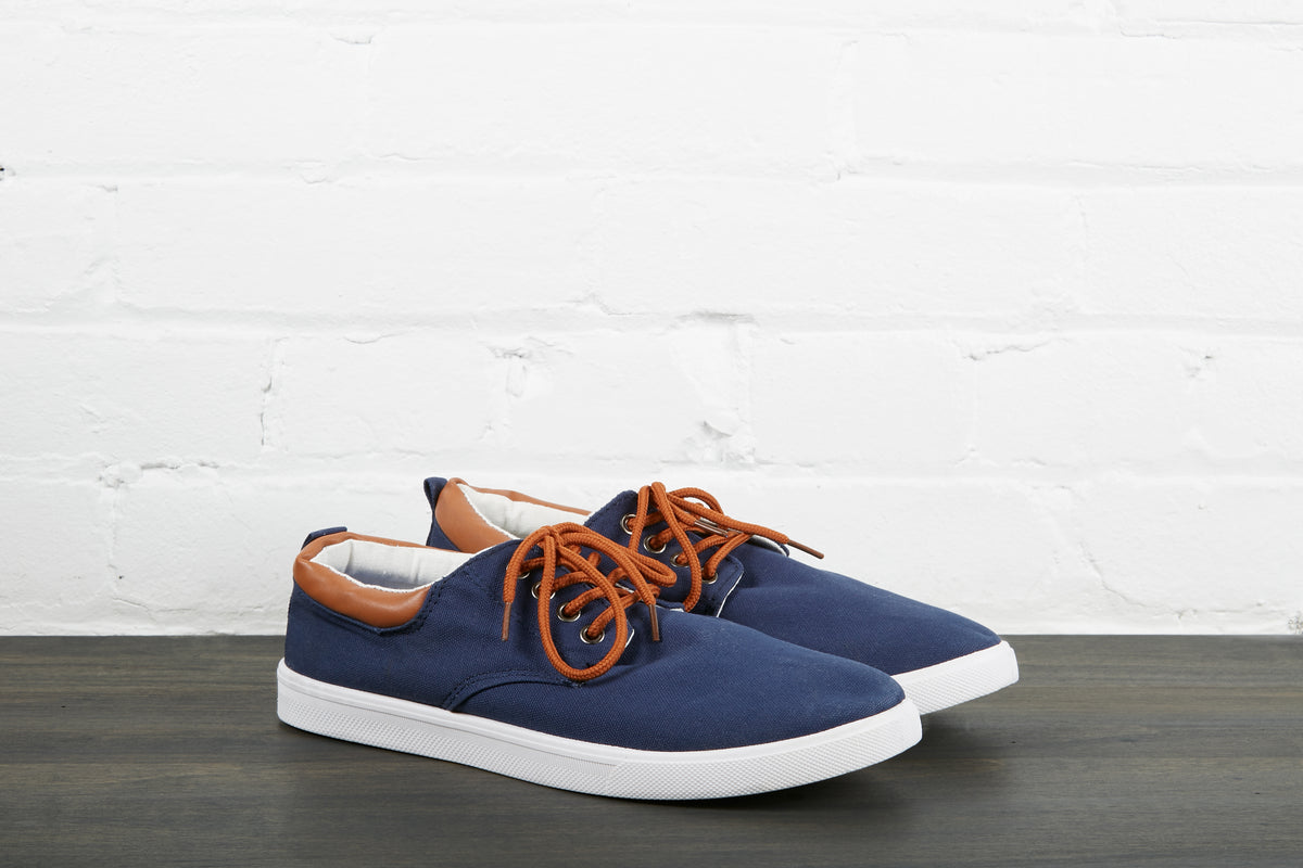 pair of navy blue skate shoes