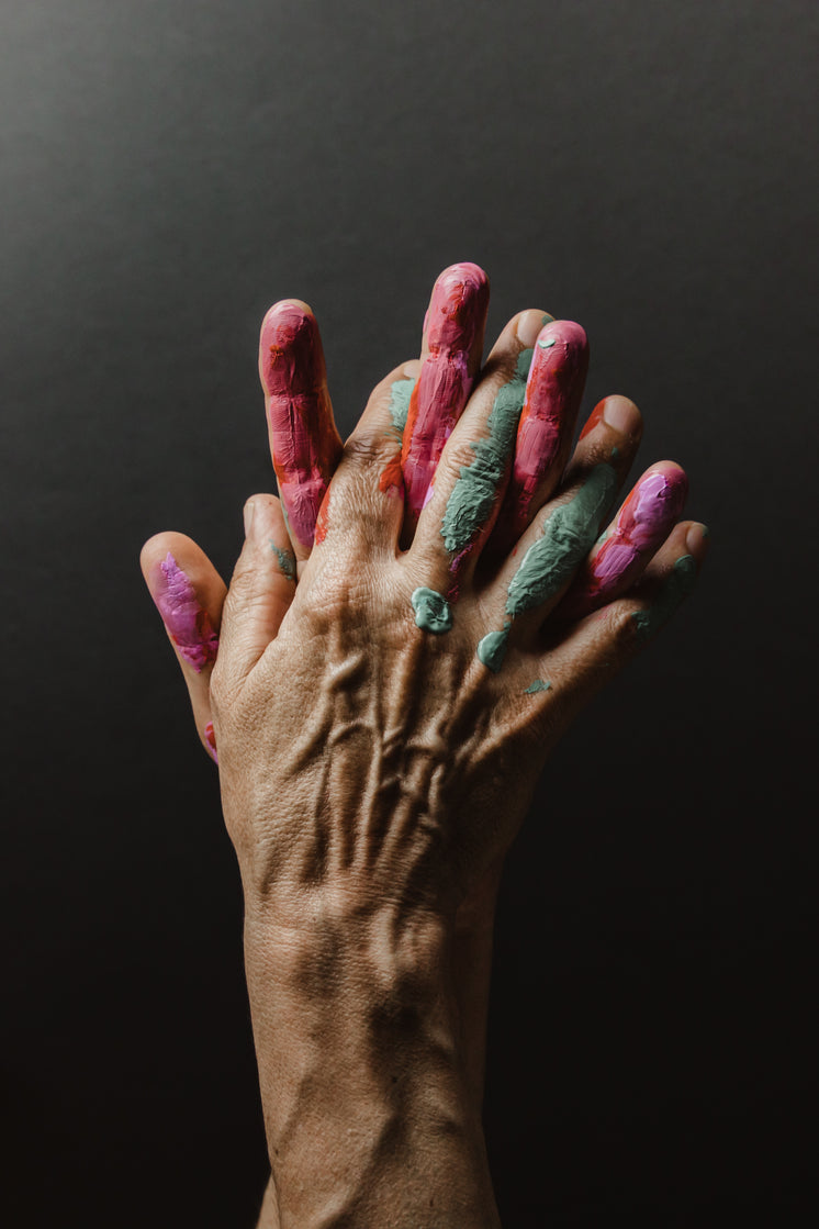 palms-together-covered-in-green-and-pink-paint.jpg?width=746&format=pjpg&exif=0&iptc=0