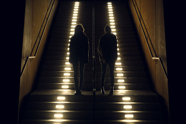 pals stand on lit steps