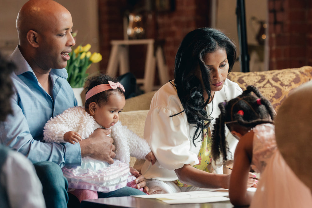 parents and two daughters in family room