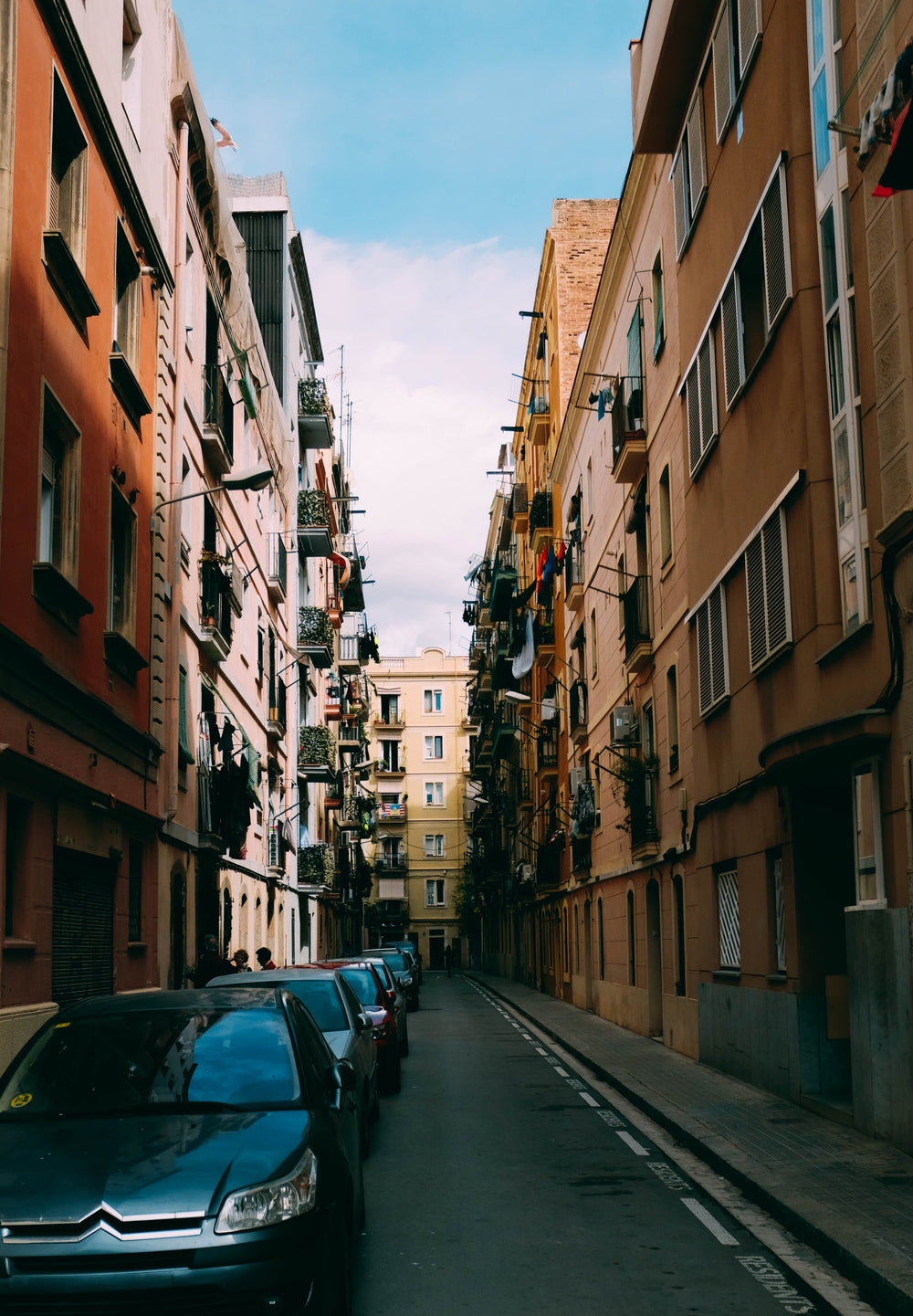 parked cars in narrow lane