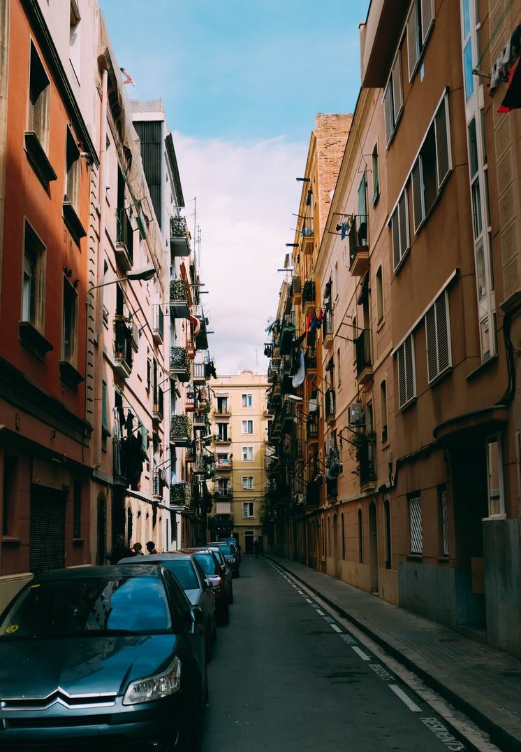 Parked Cars In Narrow Lane