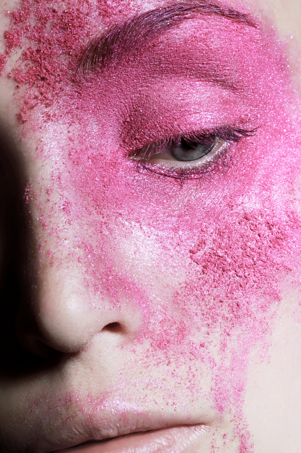 part of face covered with pink powder