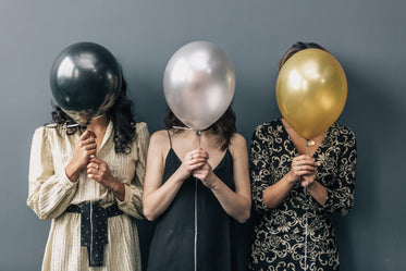 party balloons in front of faces