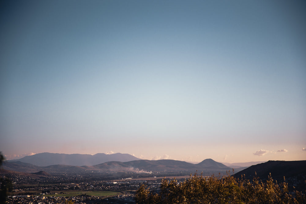 pastel skies over green village